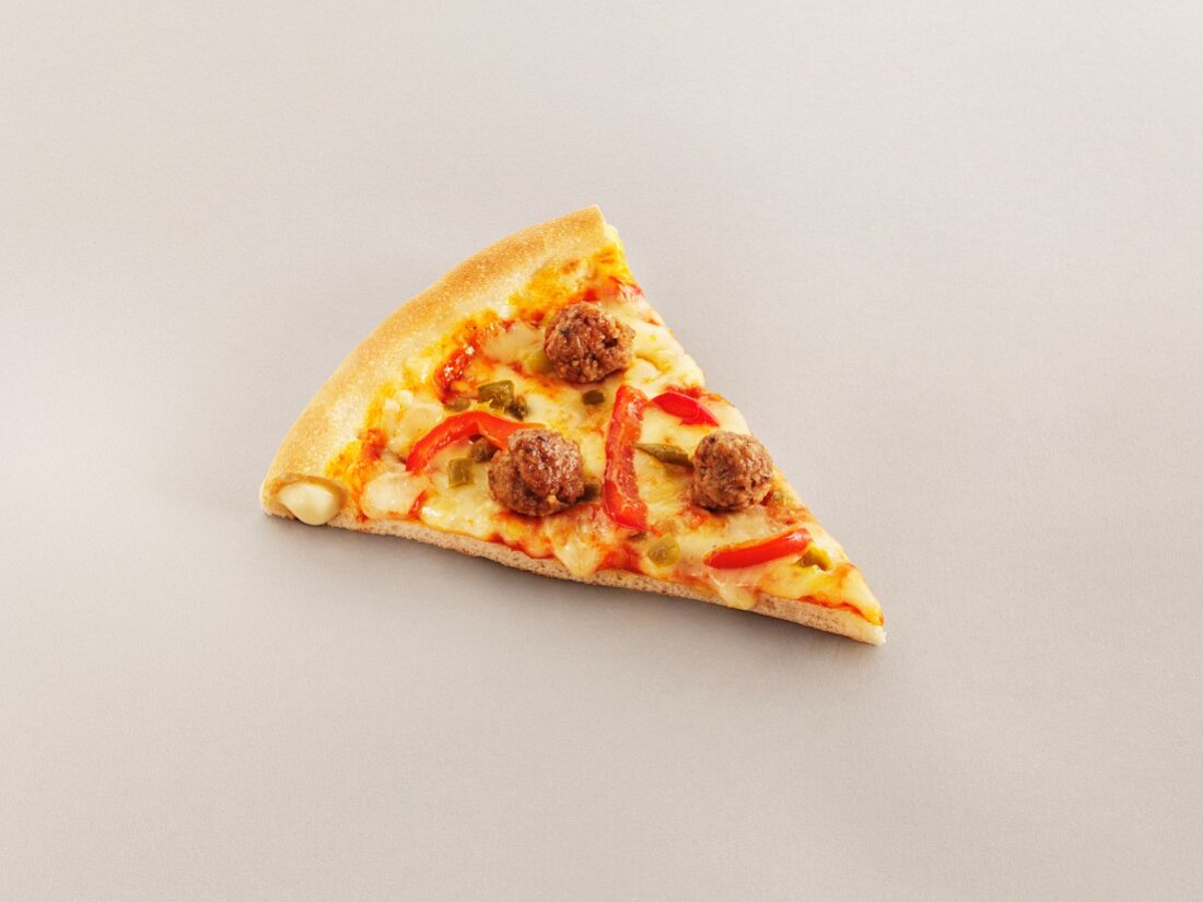 A slice of stuffed crust pizza with meatballs and peppers