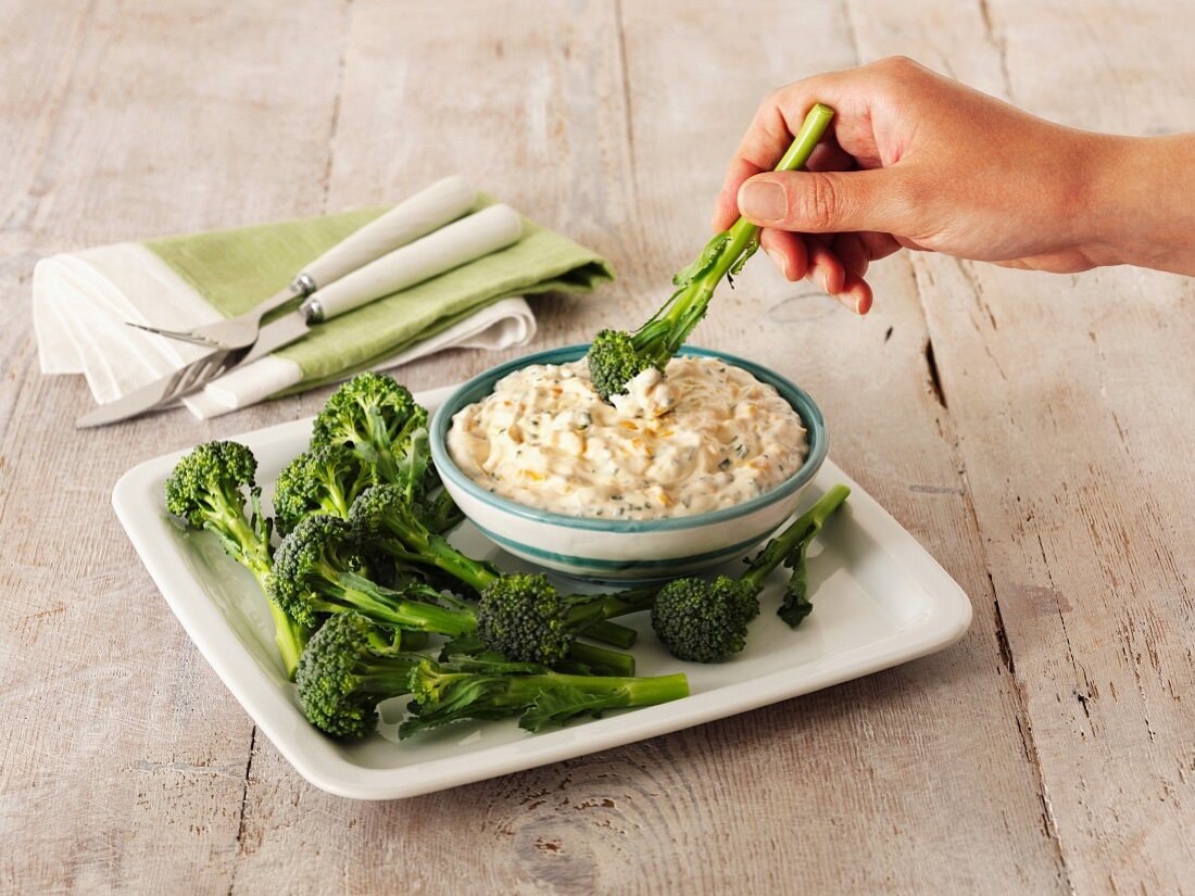 A cheese and chive dip with broccoli
