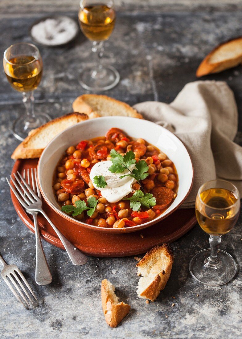 Chickpea stew with chorizo, sour cream and coriander