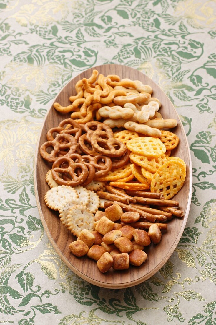 Snacks on an oval wooden plate