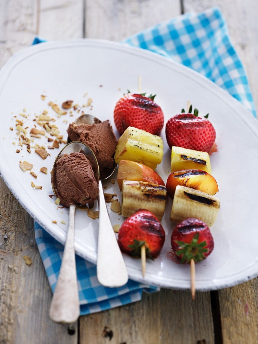 Grilled fruit skewers with chocolate ice cream
