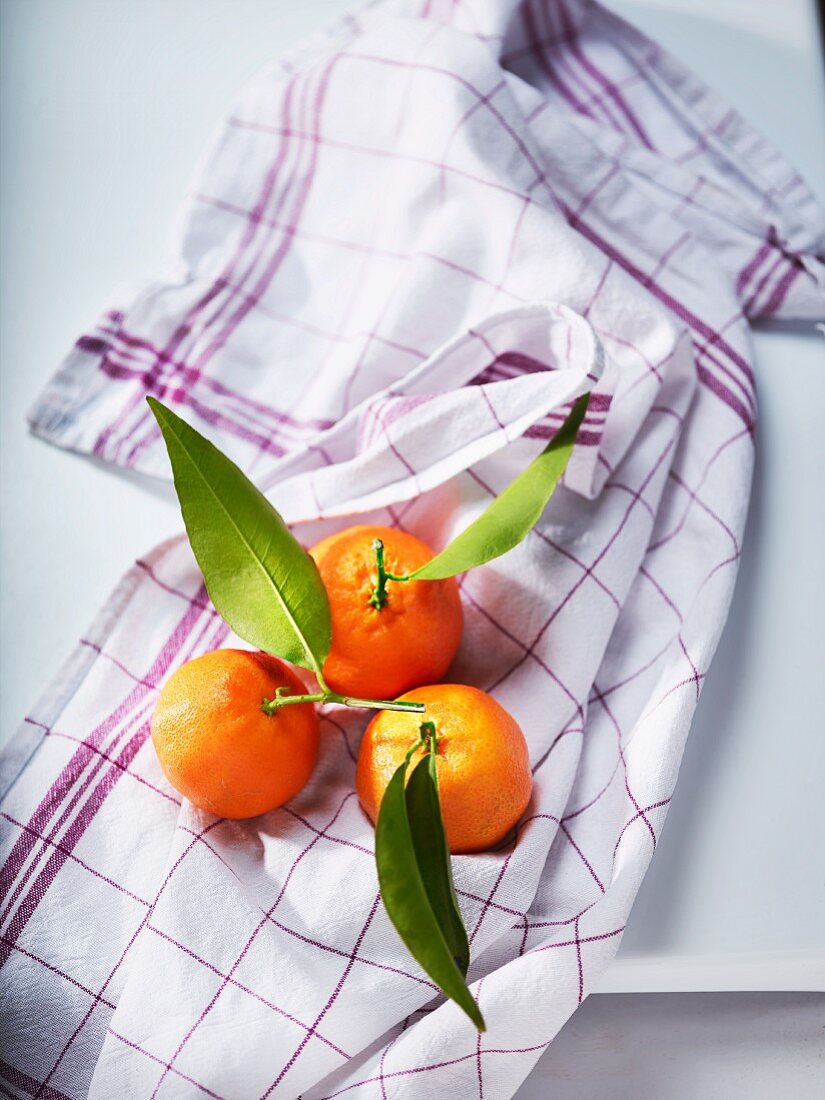 Clementines on a tea towel