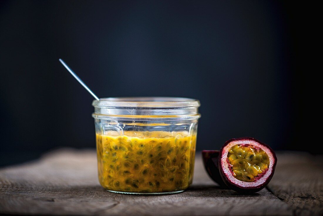 Passion fruit sauce and a halved passion fruit