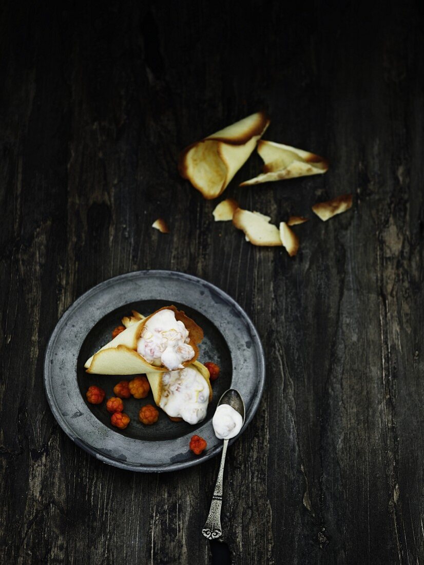 Waffle biscuits with fruit yoghurt and cloudberries