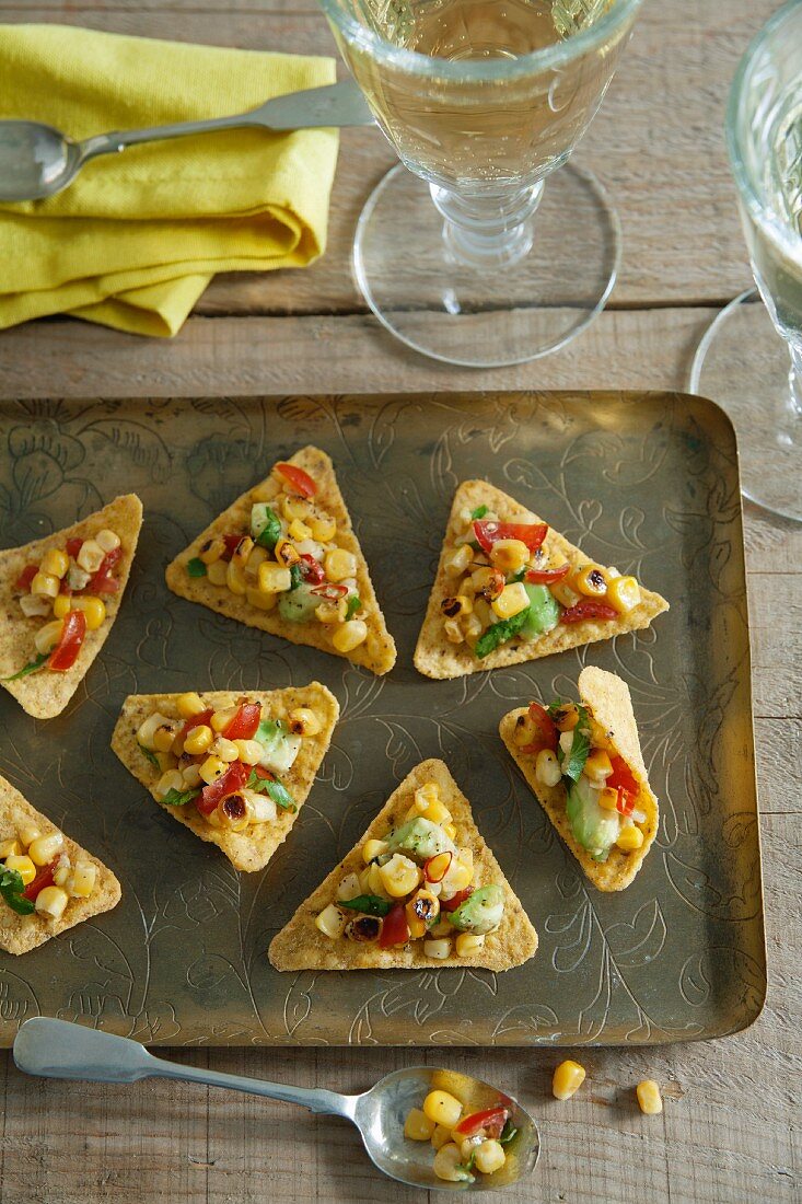 Tortilla chips with a sweetcorn and avocado salsa