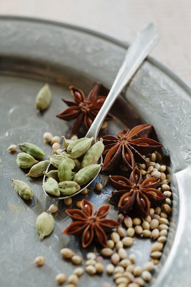 An arrangement of cardamom, star anise and coriander