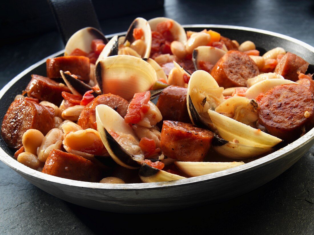 Mussels and sausage with white beans and tomatoes