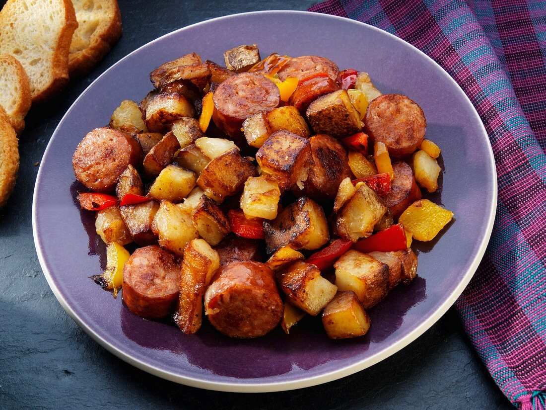 Fried potatoes with sausage, peppers and onions