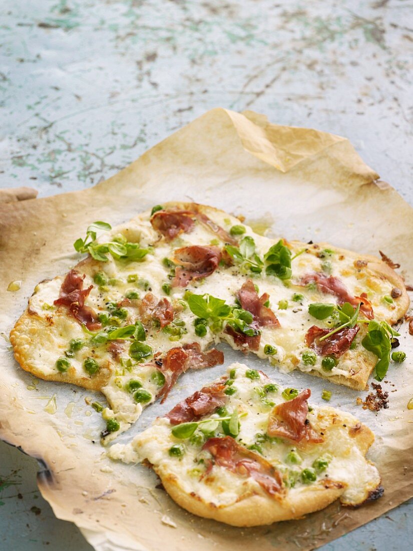 Pizza with bacon and peas