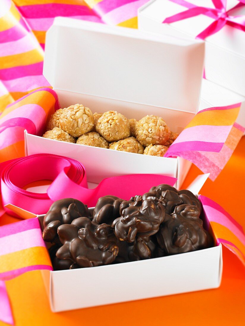 Various pralines in gift boxes