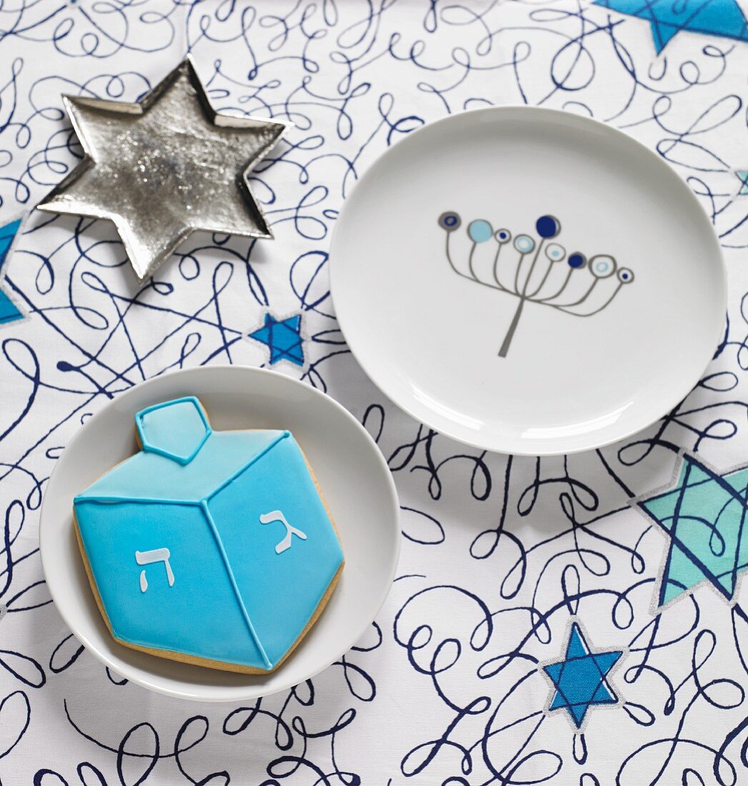 A start-shaped sliver dish, a plate and a a biscuit for Hanukkah