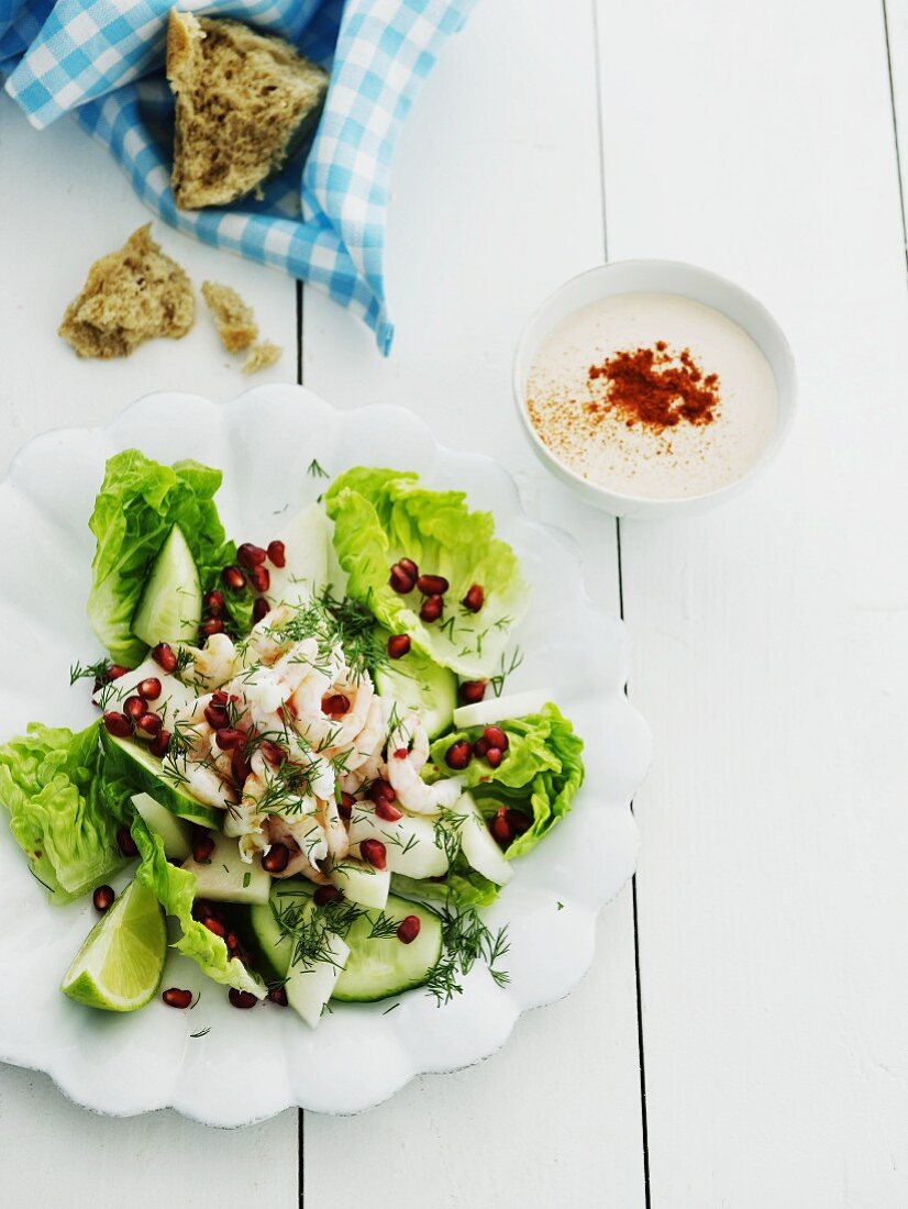 Cos lettuce with cucumber, shrimps, dill and pomegranate seeds served with yoghurt vinaigrette