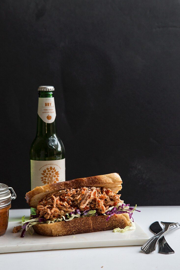 A pulled pork sandwich and a beer