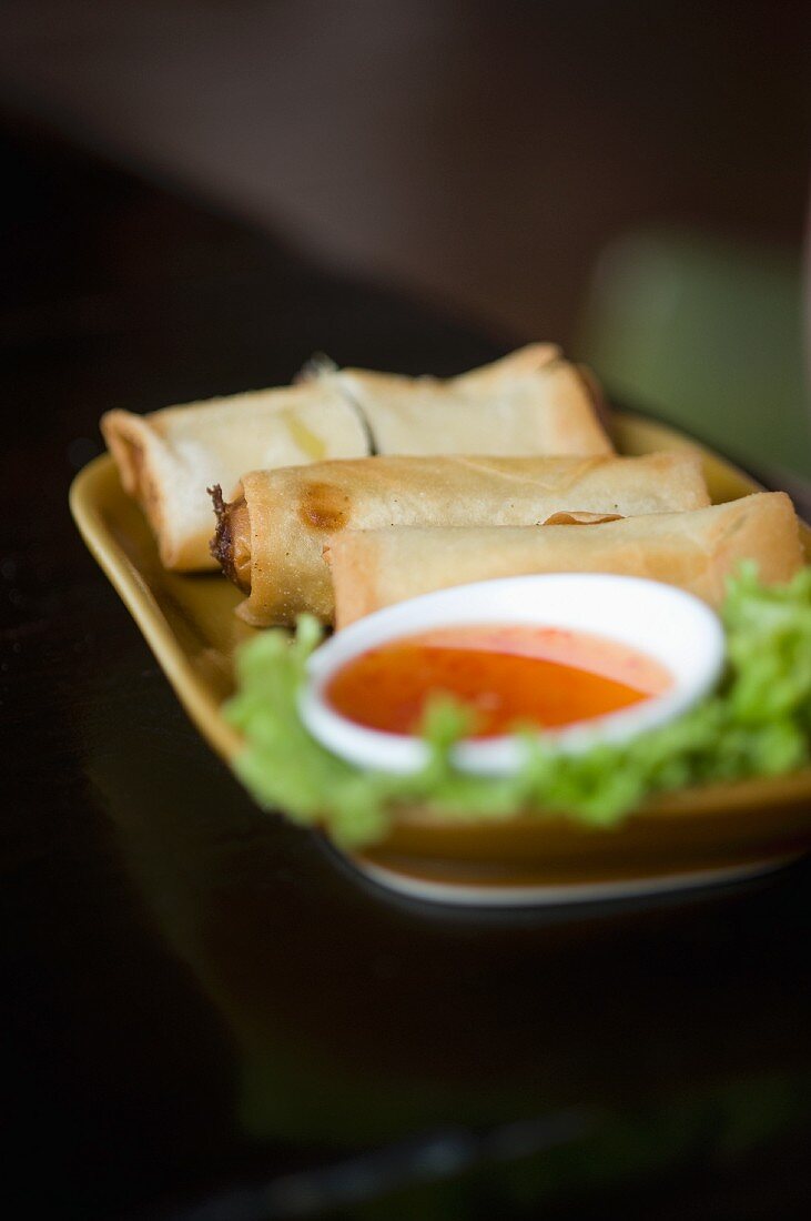 Spring rolls with a dip at a market in China Town (Bangkok, Thailand)