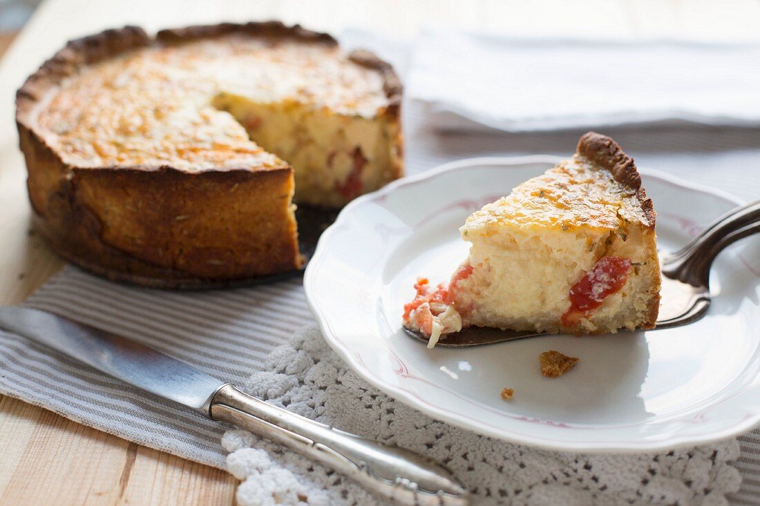 Tomato and rosemary quiche, sliced