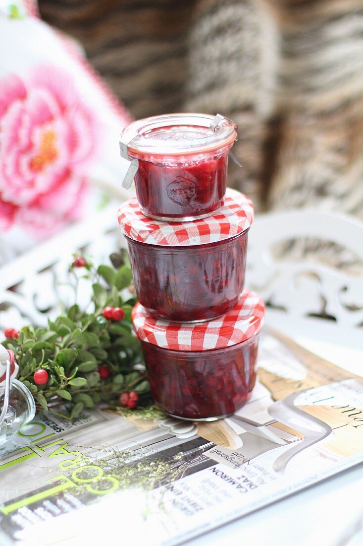 A stack of three jars of cranberry jam