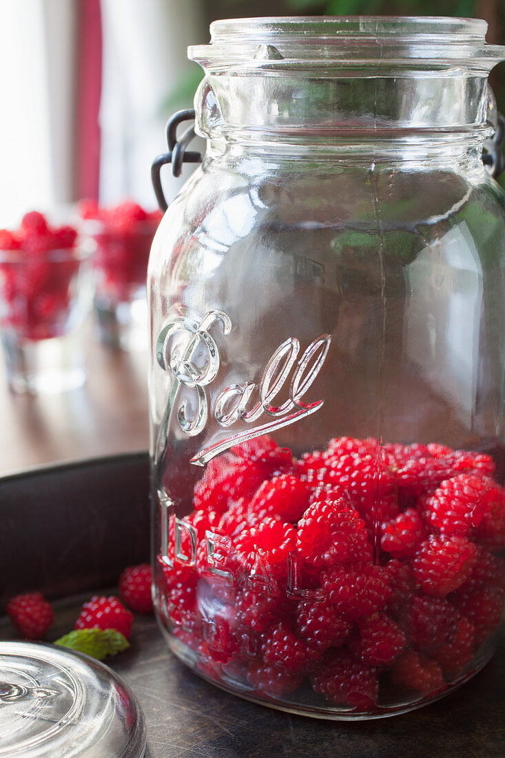 Wild raspberries in an old preserving jar