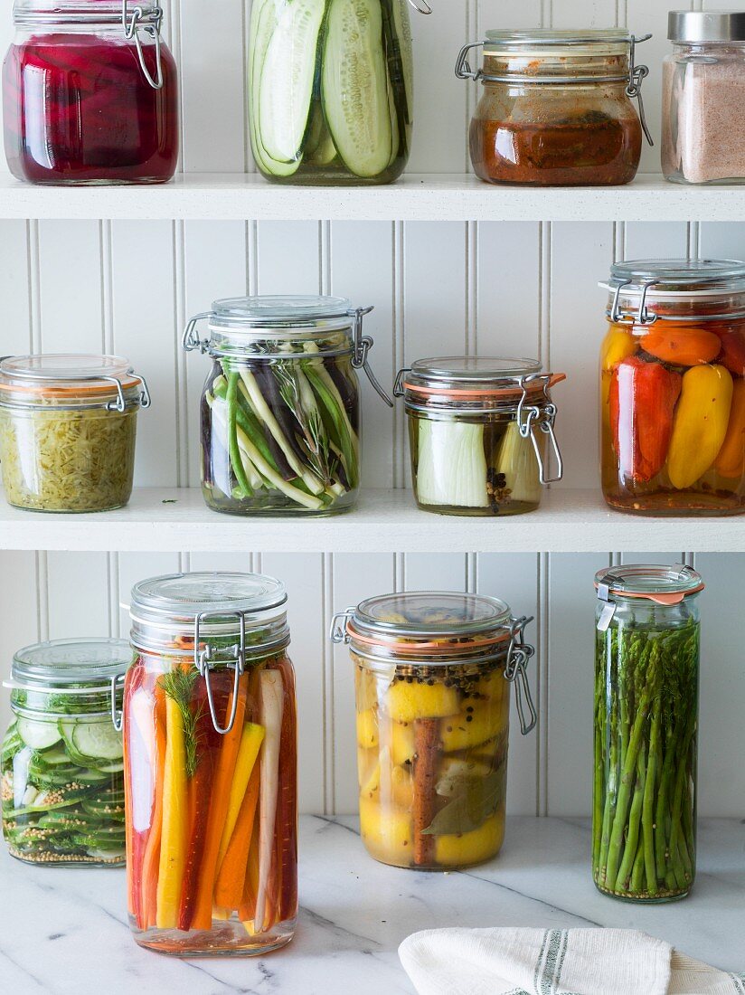 Preserved fruit and vegetables on shelves in a pantry