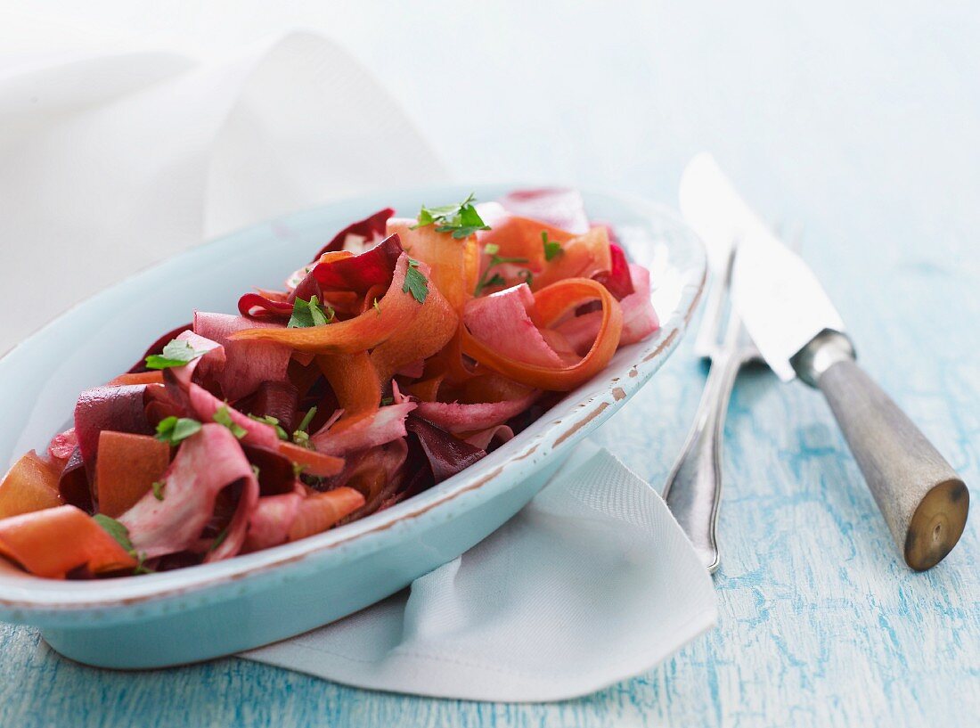 Vegetable salad with carrots, beetroot, parsnips and parsley