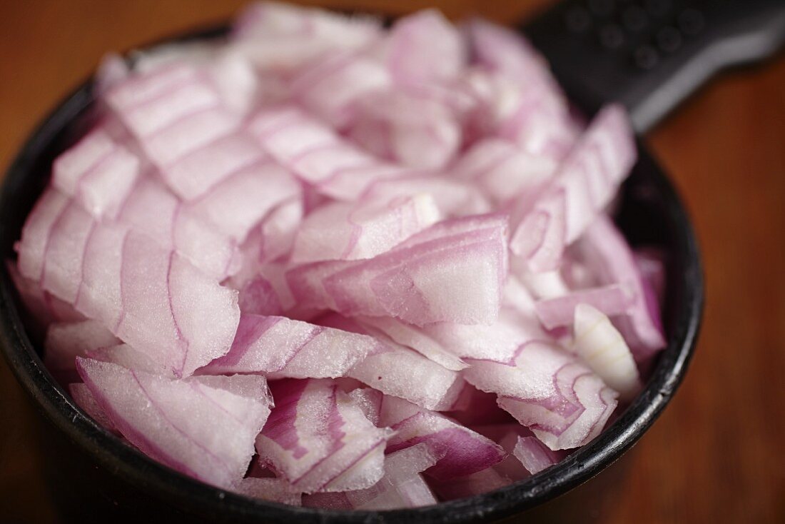 A cup of chopped red onion