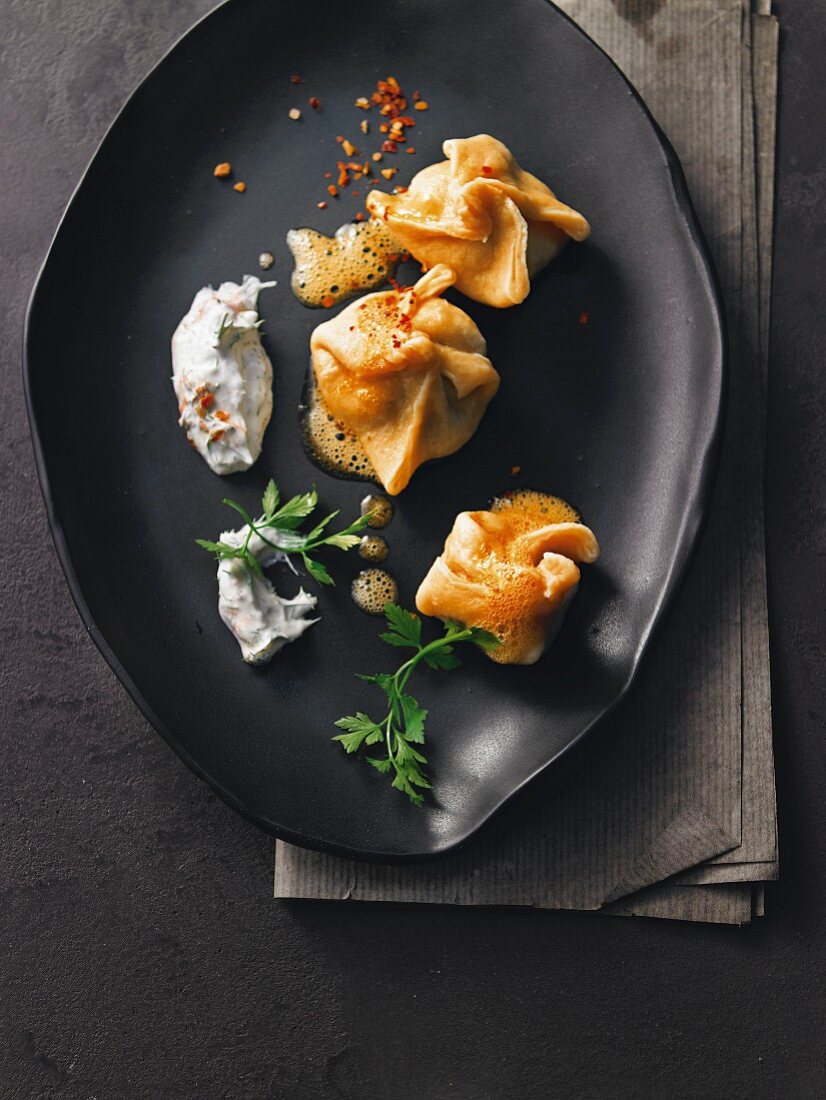 Pasta and mushroom dumplings with dill yogurt and chilli butter