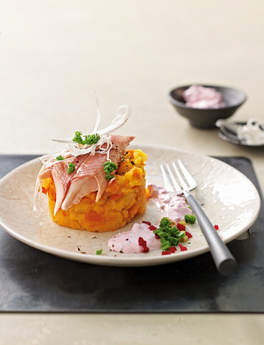 Mashed pumpkins and potatoes with smoked fish