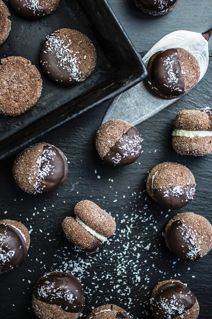 Cream-filled chocolate sandwich biscuits with grated coconut