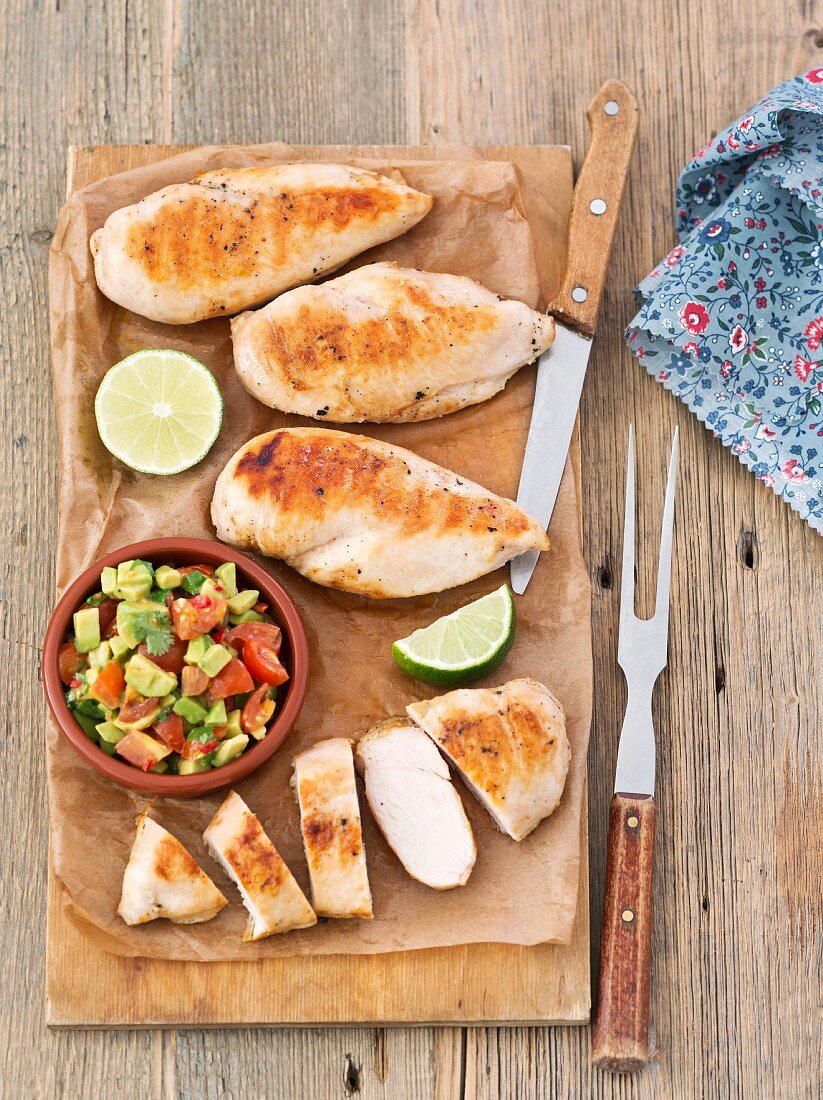 Grilled chicken breast with tomato and avocado salsa