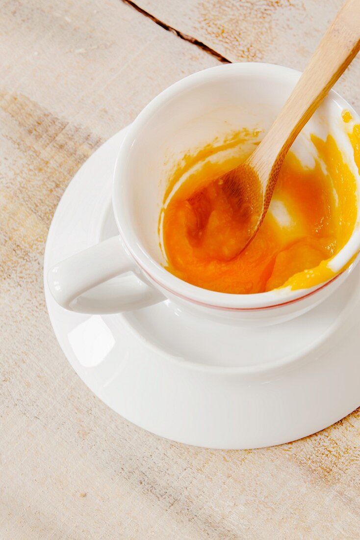 Pumpkin mousse in a cup with a spoon