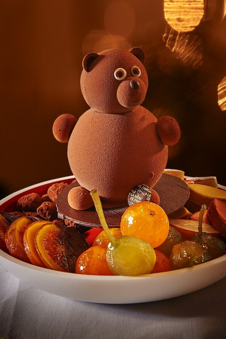 Candied fruits on a plate decorated with a teddy bear