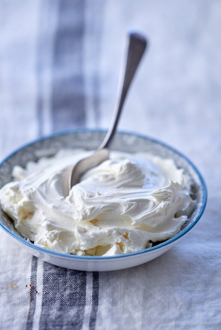 Mascarpone in a bowl with a spoon