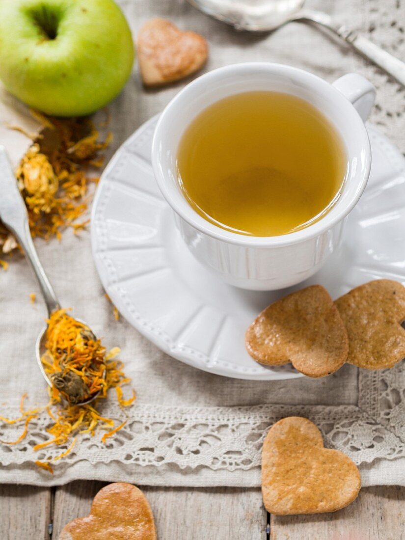 Marigold tea and heart-shaped biscuits