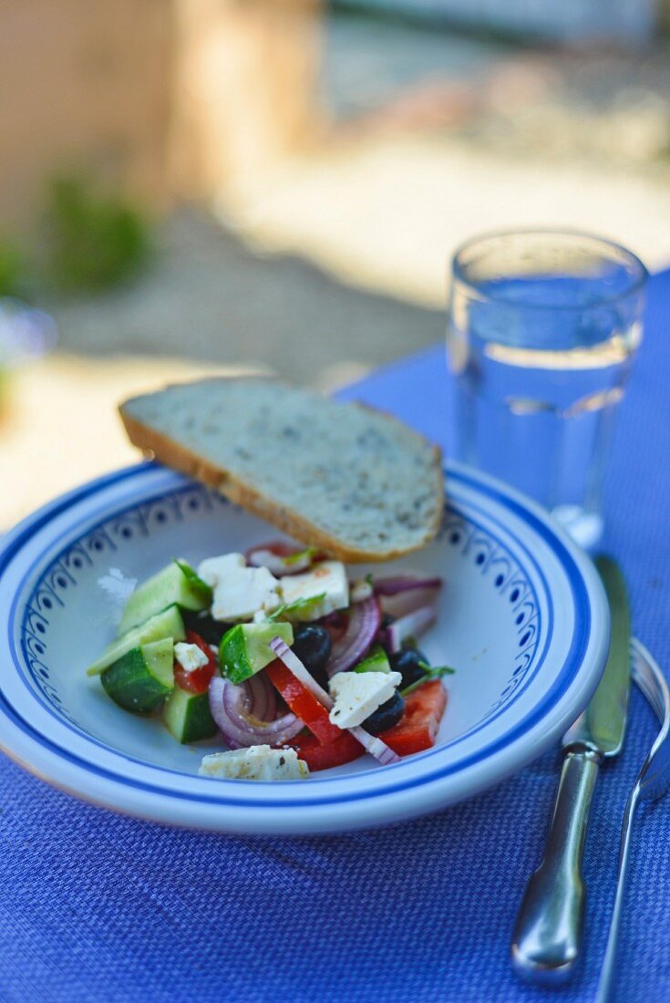 Greek salad on table out of doors