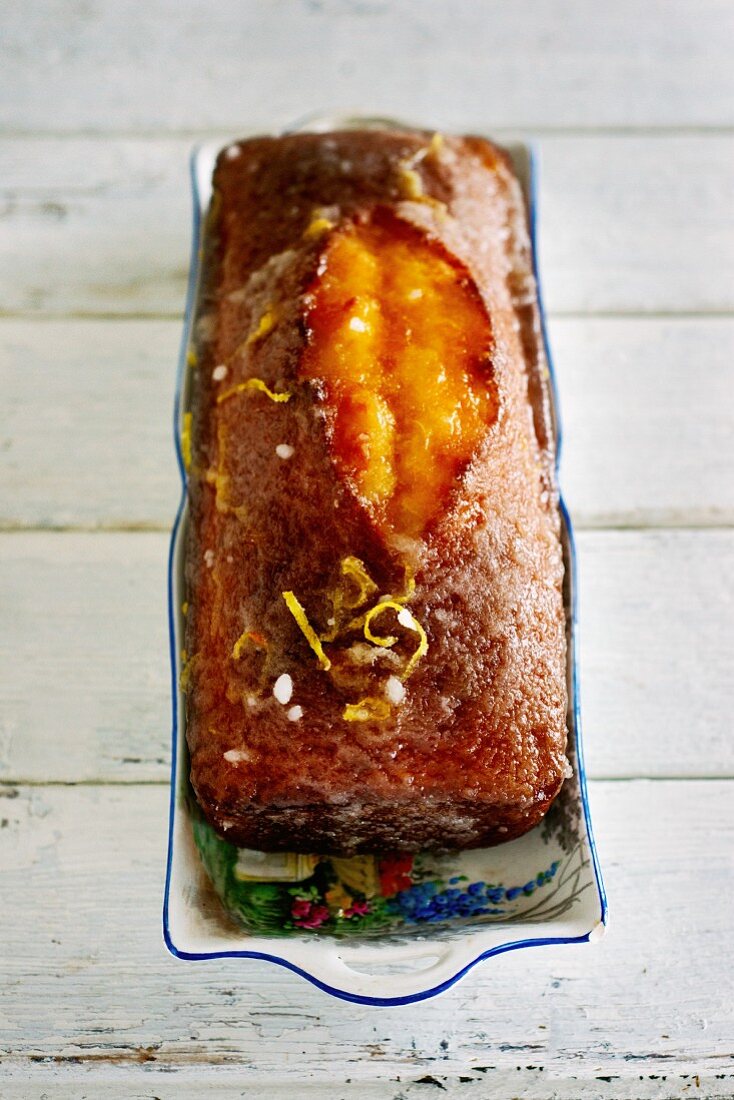 Lemon drizzle cake in a porcelain dish