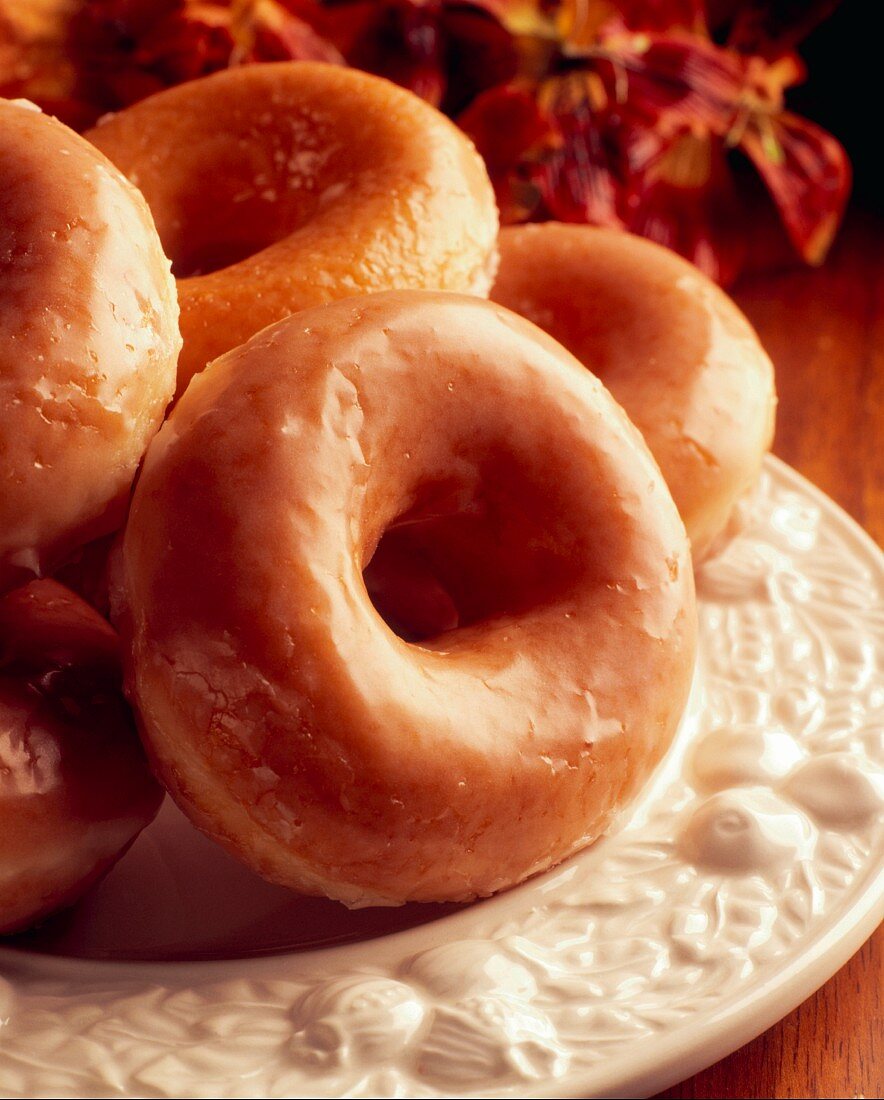 Glazed doughnuts on a white plate