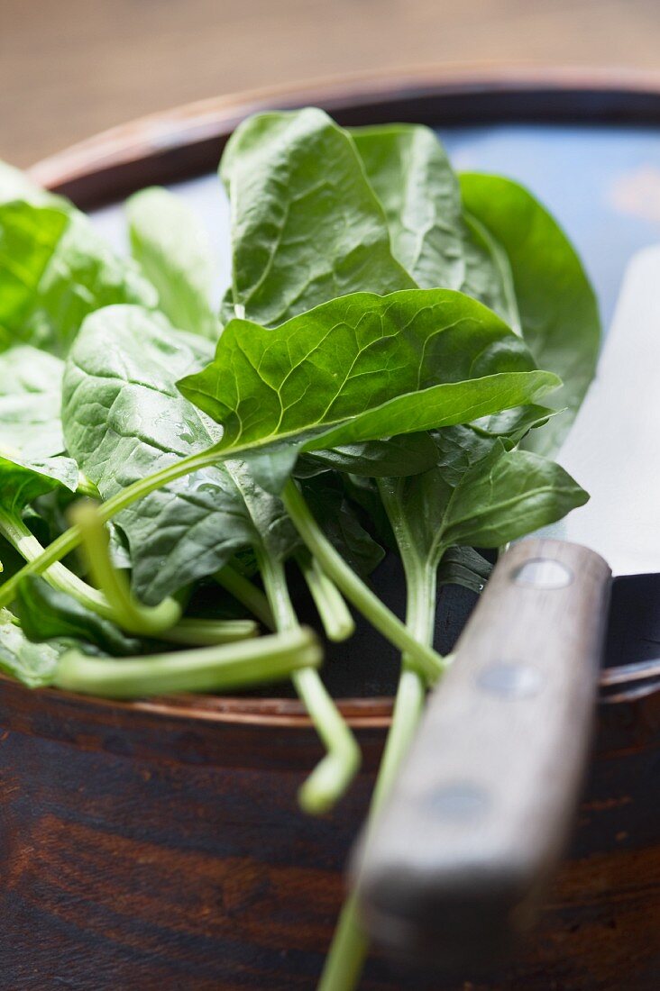 Organic spinach and a knife
