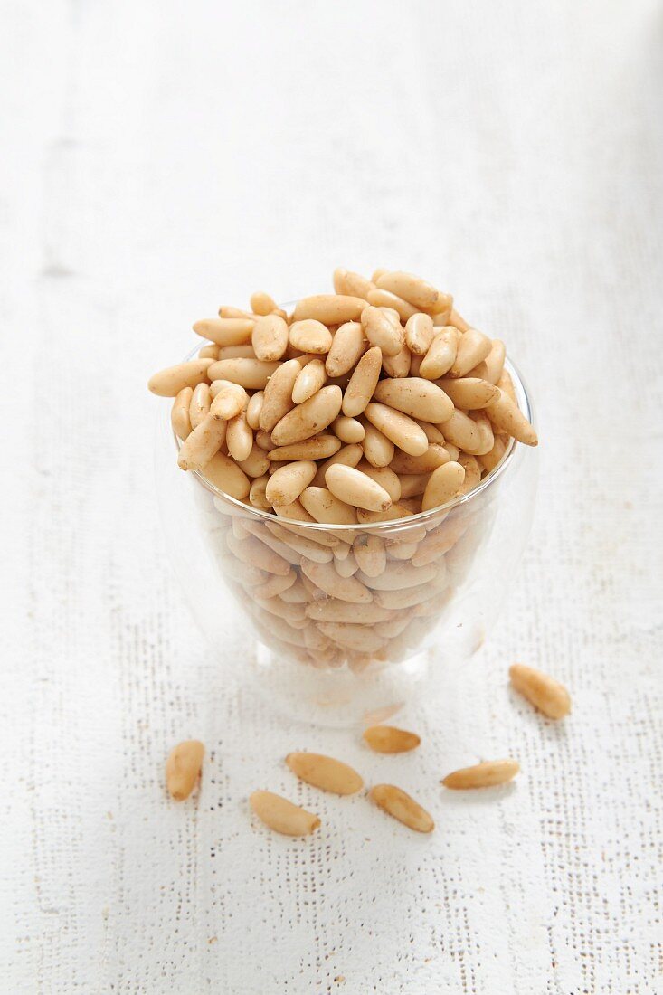 A glass of pine nuts