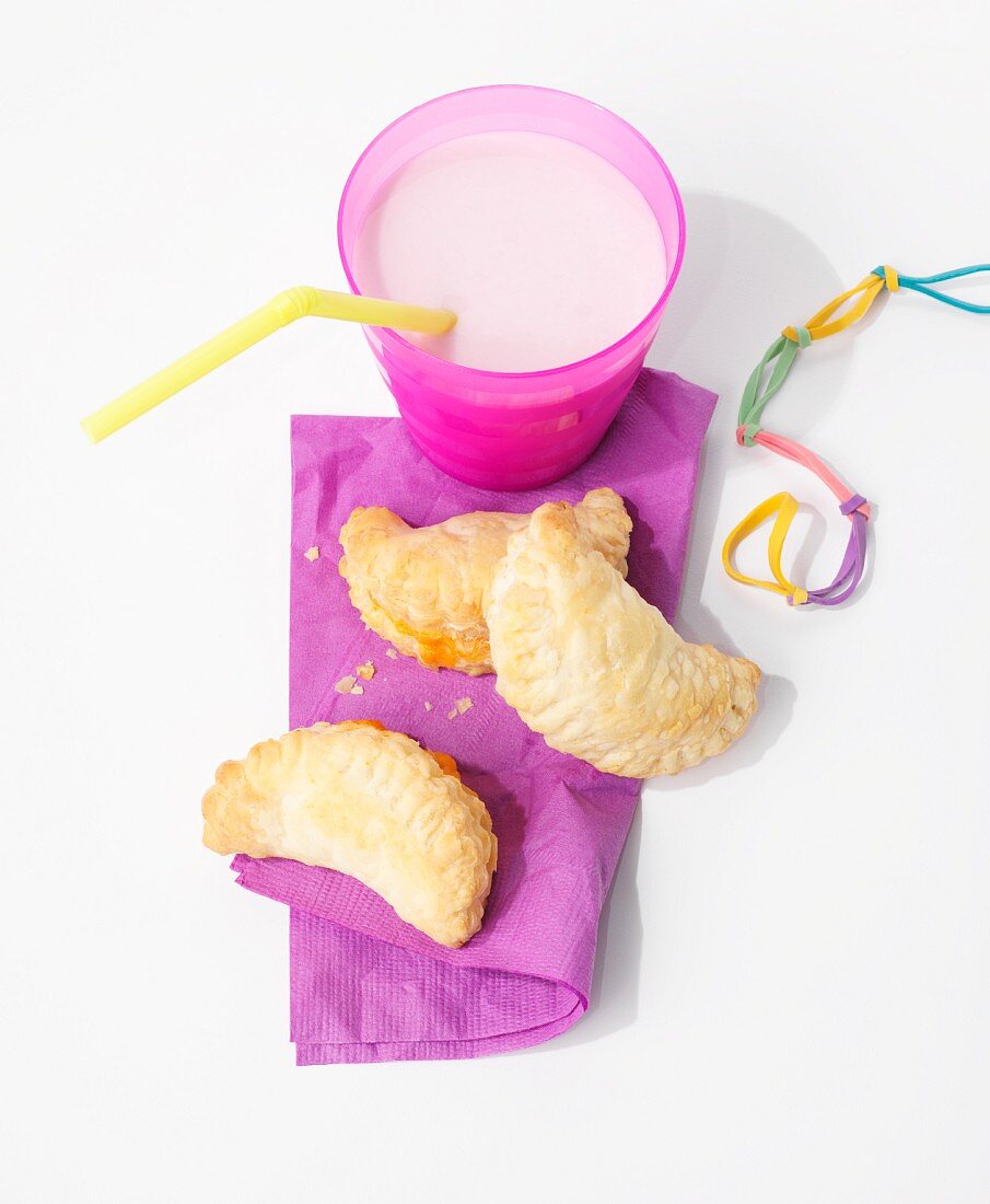 Empanadas with a cheese filling and milk as a snack for children
