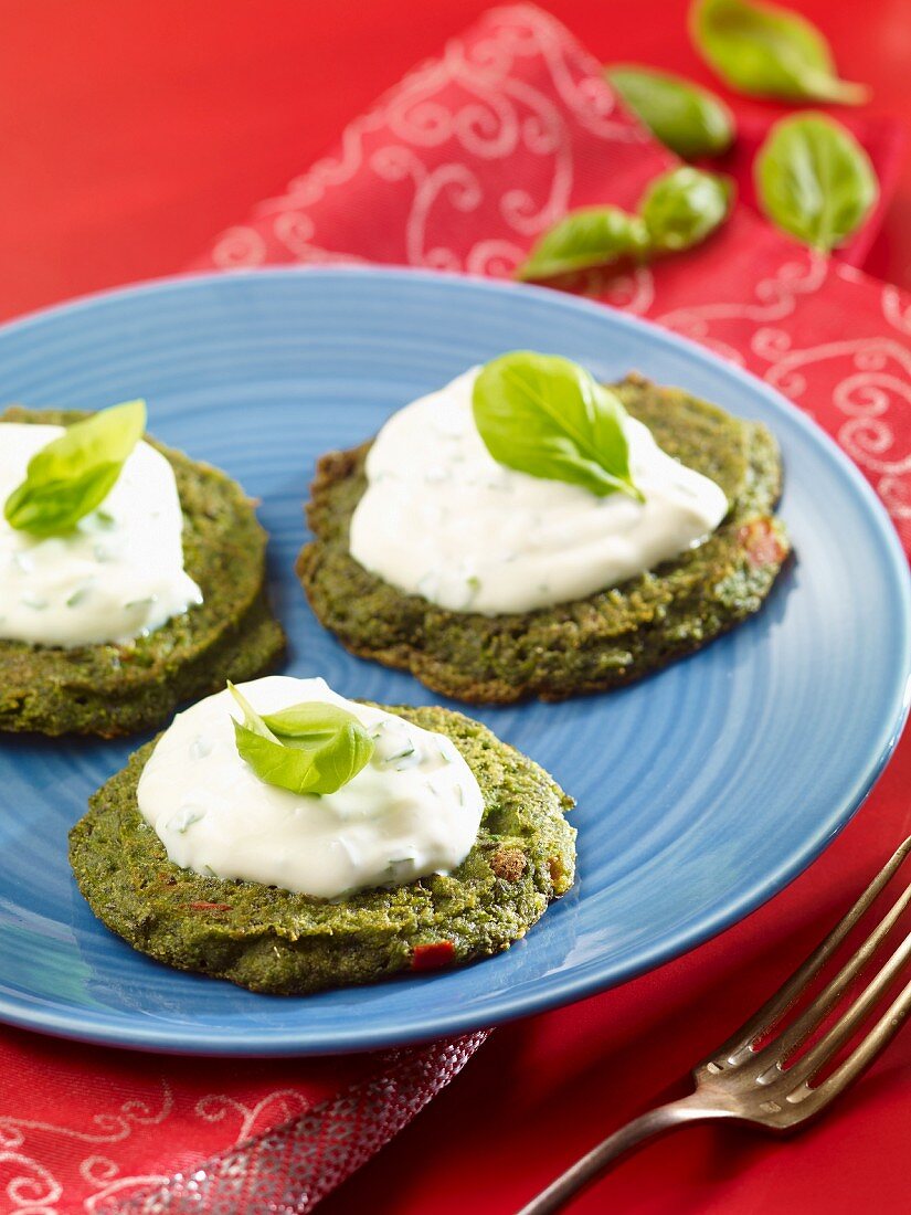 Spinach pancakes with a yoghurt dip and basil