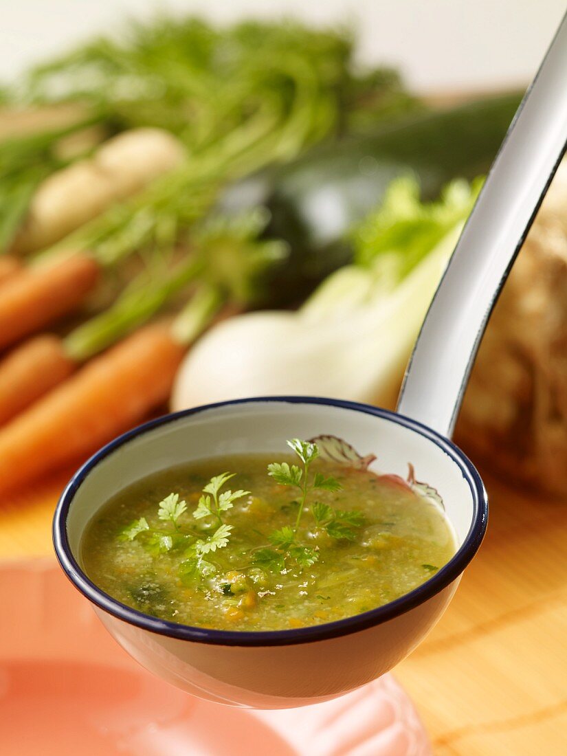 A fasting broth with spelt in a ladle