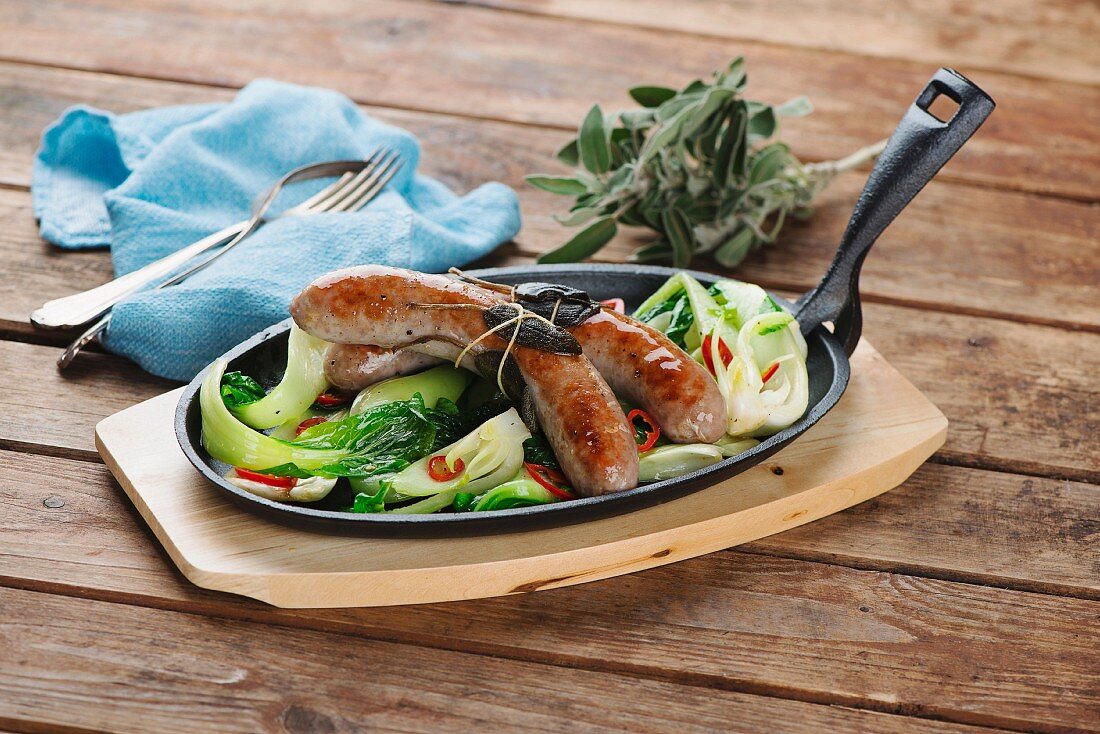 Sausages with bok choy and sage