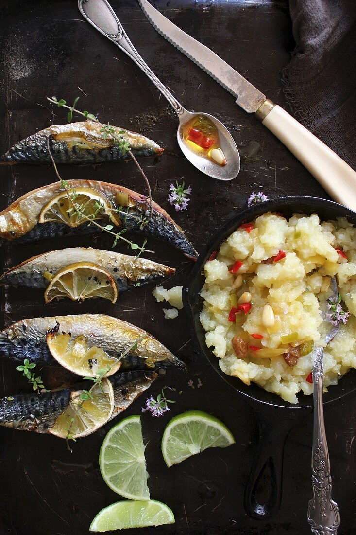 Fried mackerel and mashed potatoes with chilli oil and pine nuts