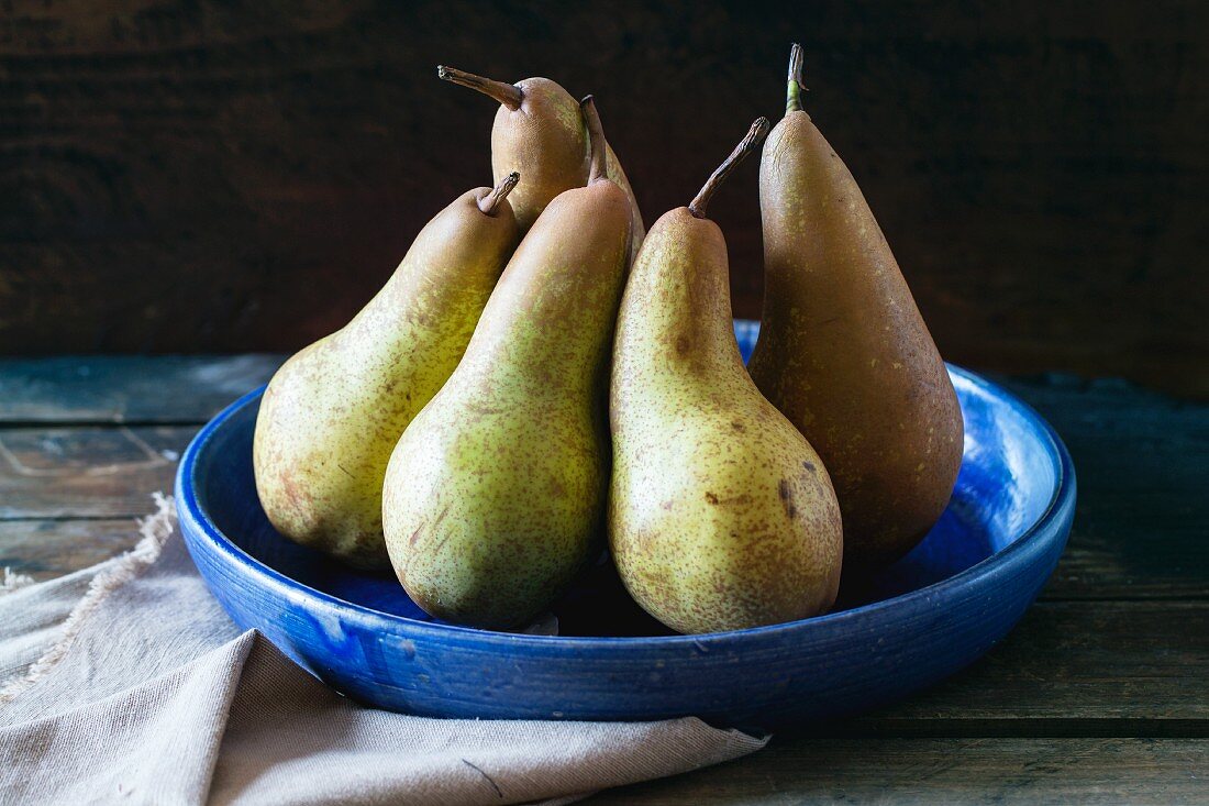 Pears in blue ceramic bowl