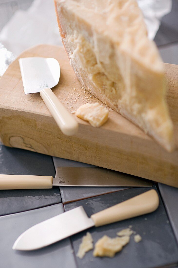 A slice of Parmesan and a cheese knife