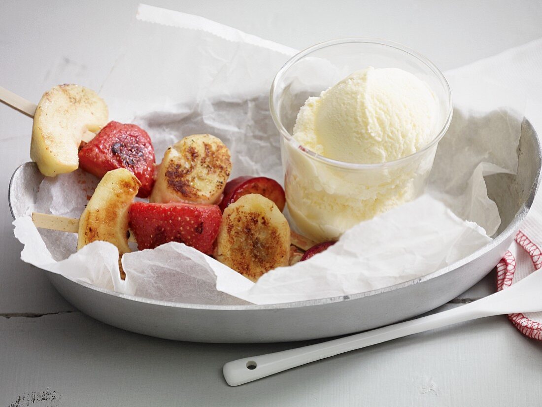 Grilled fruit skewers with vanilla ice cream