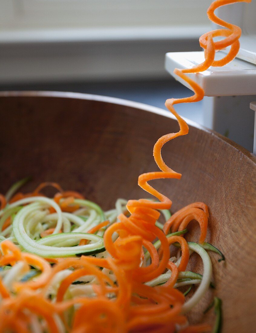 Carrot spirals being cut with a spiral cutter