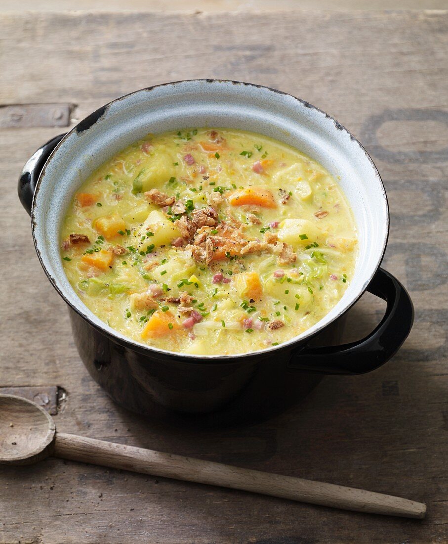Potato soup with carrots, leek and diced ham