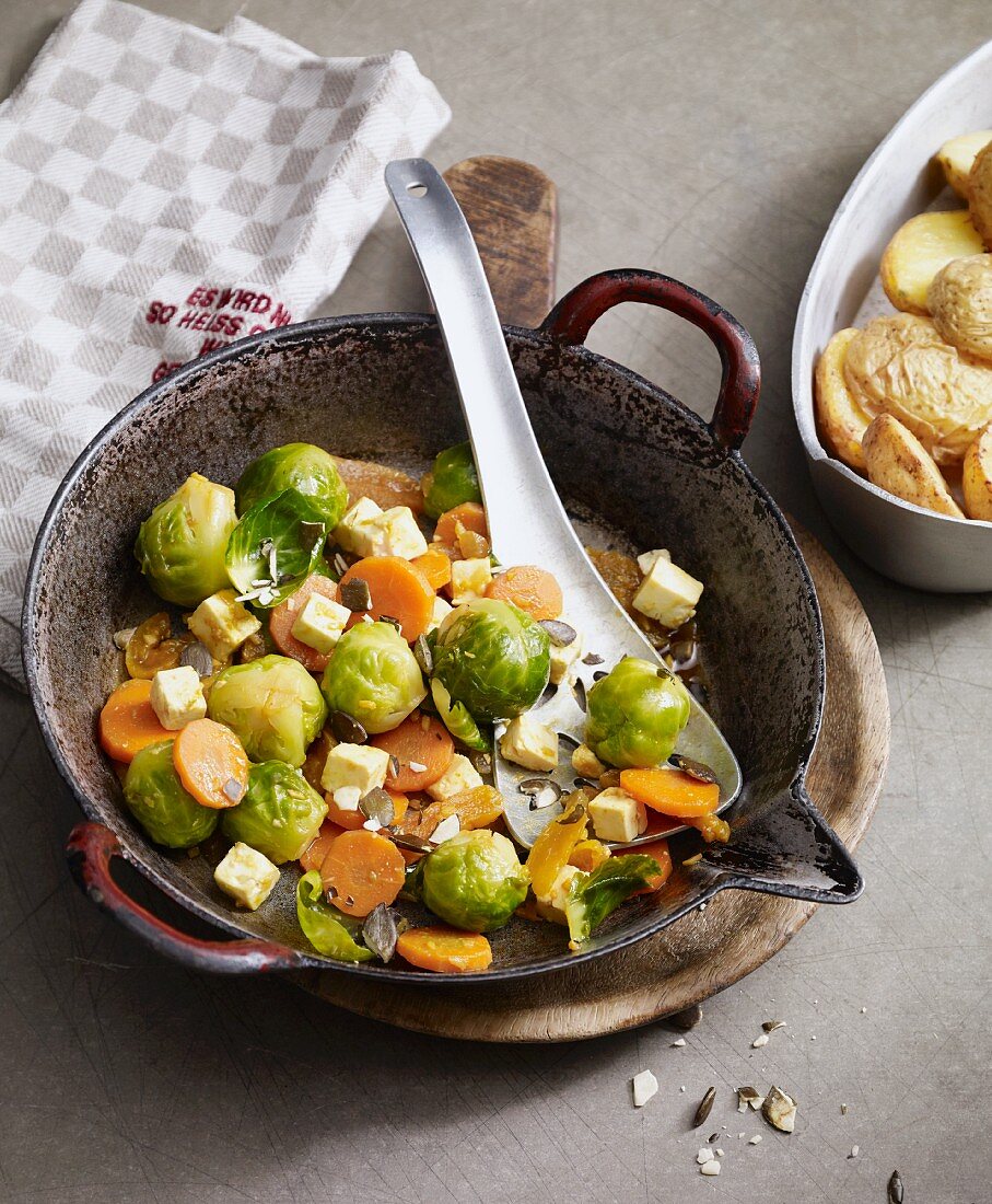 Stir-fried oriental Brussels sprouts with dried apricots and sheep's cheese