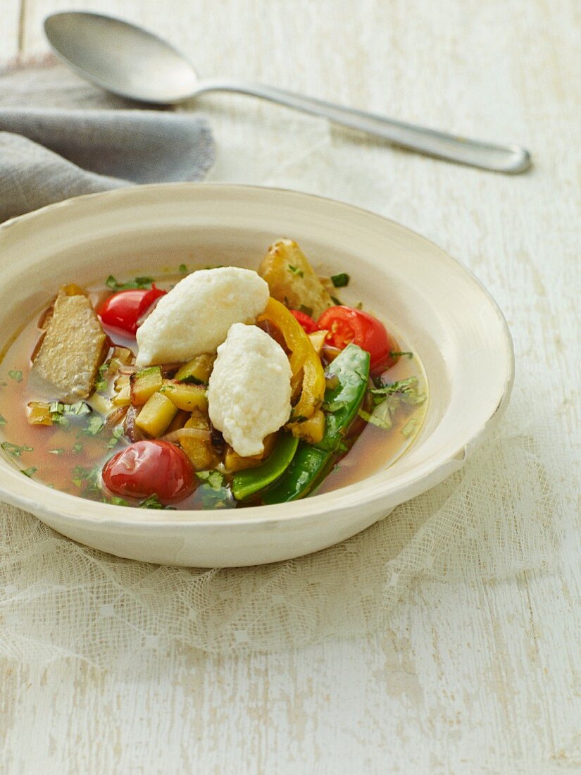 Summer vegetable stew with ricotta dumplings