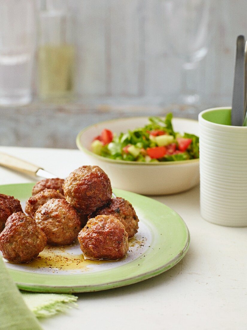 Meatballs with a colourful salad